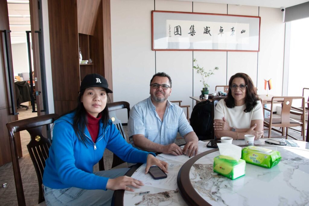 Grenada client receiving HOWO dump trucks and excavators from ZW Group for construction projects