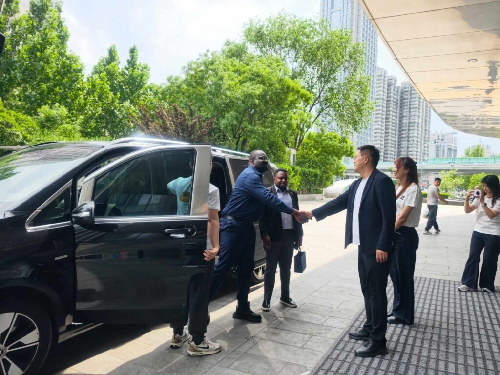 ZW Group Chairman Ivan Sun welcoming Ghana Minister-Counsellor Richmond Afotey Nii Okle to discuss Heavy Duty Trucks China.
