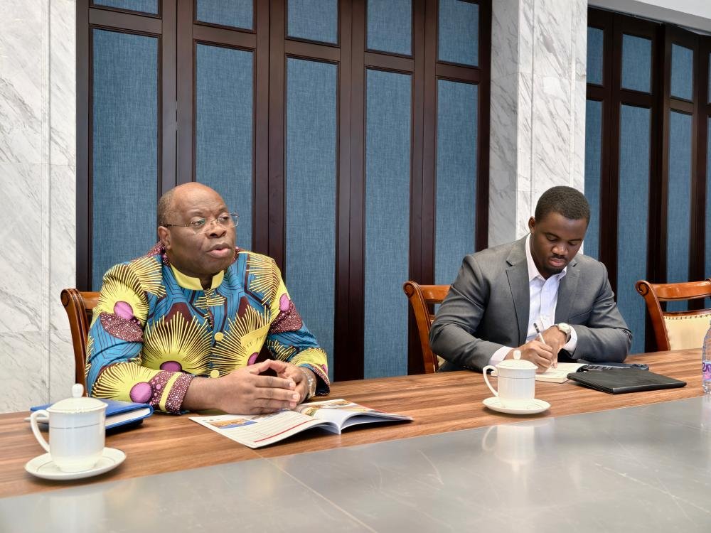 The Ambassador of Gabon reviewing product catalog of ZW Group, a leading Commercial Vehicle Manufacturer China.