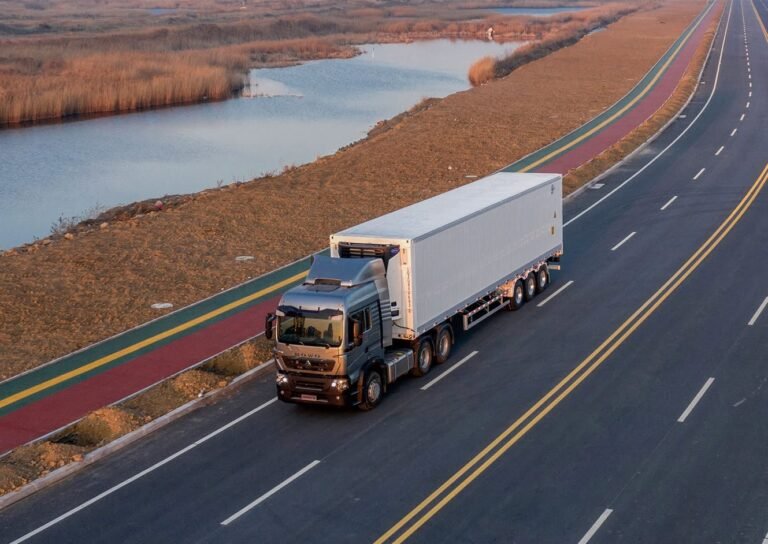 HOWO 6x4 tractor truck pulling a semi trailer on long-haul highway
